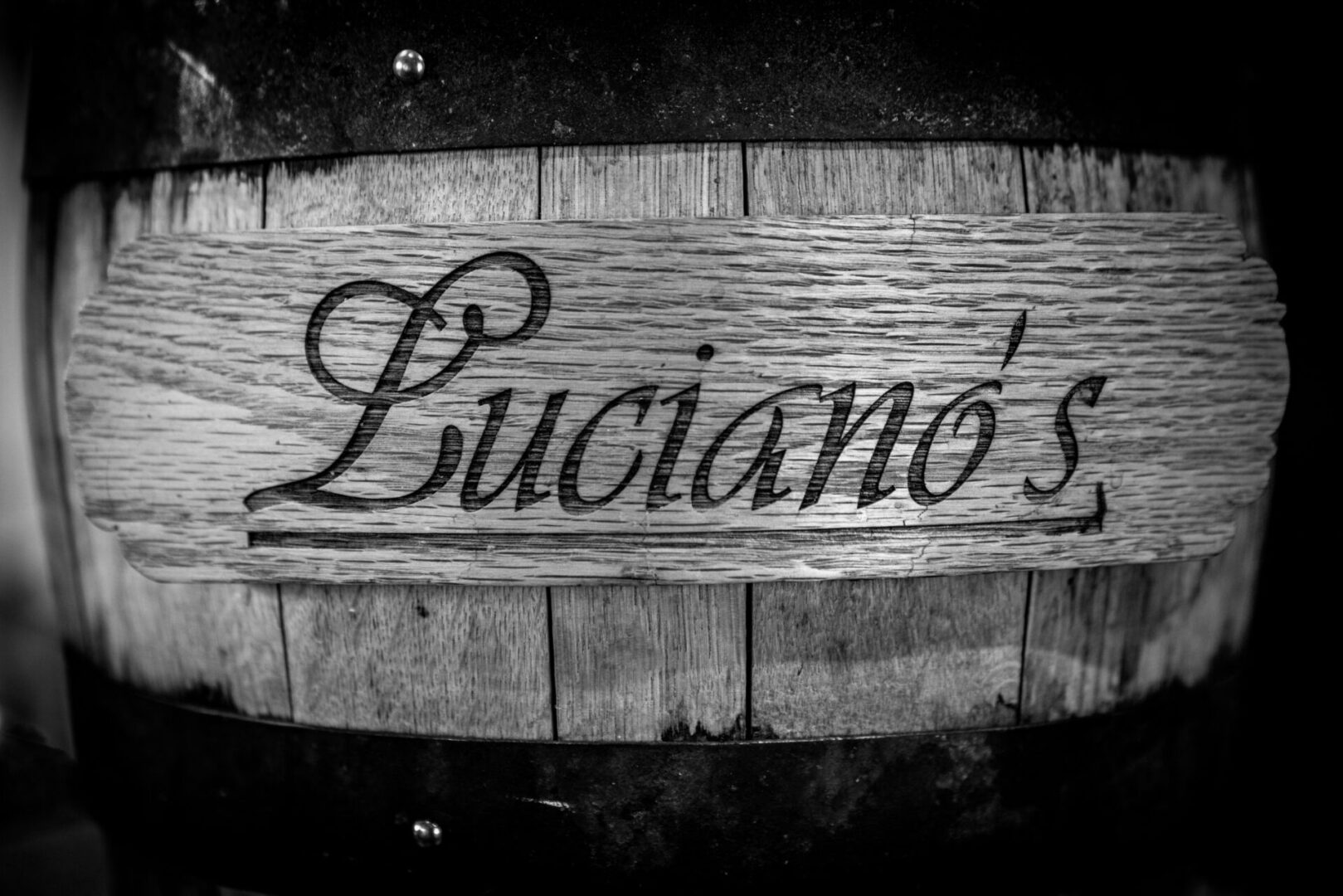A black and white photo of the name luciano 's